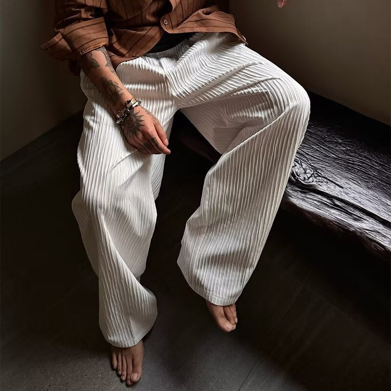 Pantalones de perna ancha con textura plisada